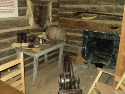 This exhibit shows what the inside of a typical log cabin home would have looked like.