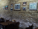 The Port Royal Cafe displays some paintings and photos of the old covered bridge.